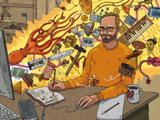 A professor sits at a computer whose screen is shooting out a beam of light filled with all sorts of animals and musical instruments