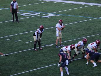 Harvard quarterback Charlie Dean surveying the Penn defense, on his way to one of the best days in Harvard quarterback history.