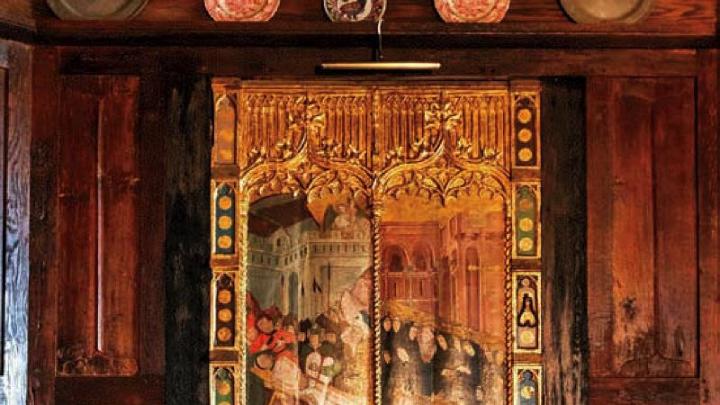 Dining room with antique chest and fifteenth-century religious painting or a martyrdom  