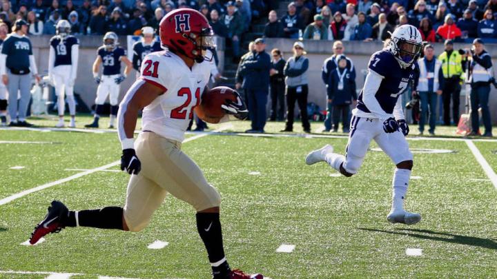 Photograph: With Yale’s Melvin Rouse II in vain pursuit, Harvard’s Aidan Borguet heads for the goal line. 