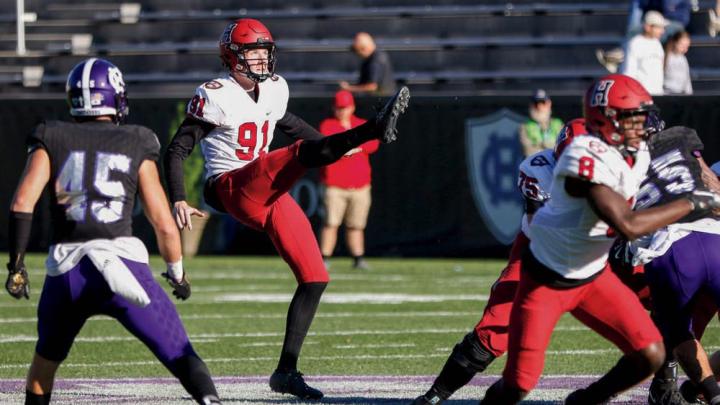 Photograph of outstanding junior punter Sean McKeogh in action against Holy Cross