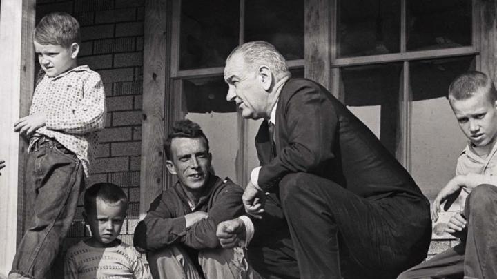 Historic photograph of President Lyndon Johnson meeting with impoverished Fletcher family in Kentucky in 1964
